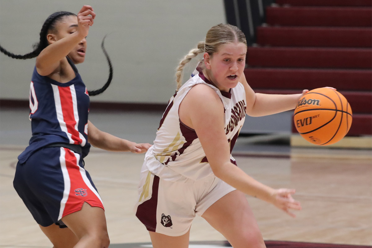 Lauren Kirsch competing on the basketball court for Commonwealth University - Bloomsburg.